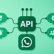 Minimalist illustration of WhatsApp Business API connected to business applications for automated messaging, notifications, customer support, eCommerce, and workflow integration.